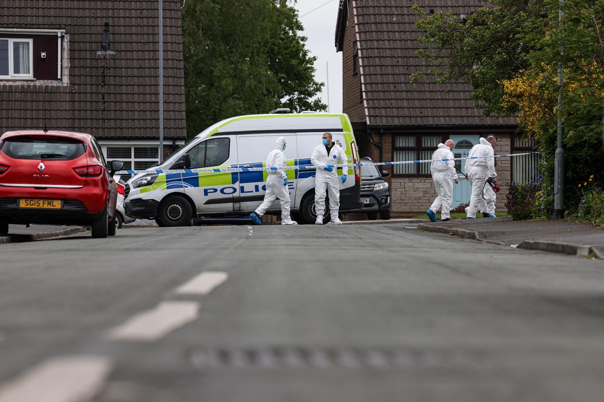 Police at the scene in Leigh, Greater Manchester