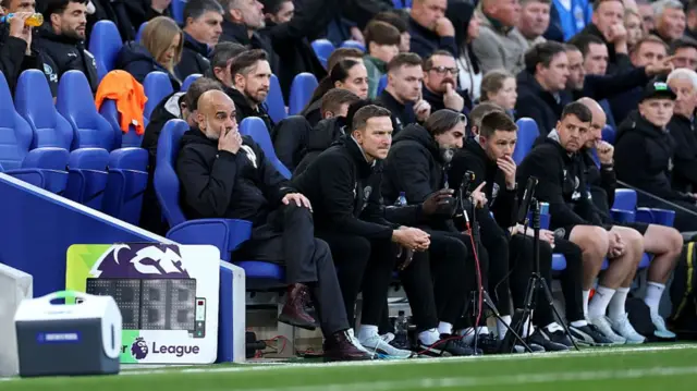 Man City boss Pep Guardiola watches his side's match against Everton