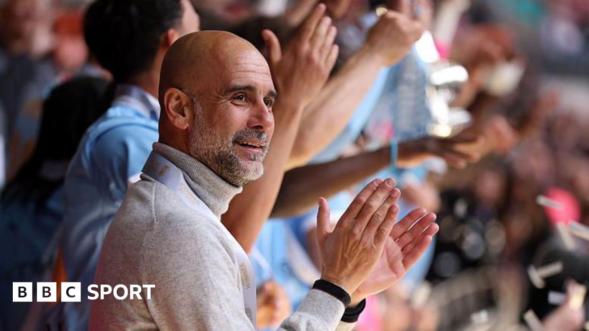 Manager Pep Guardiola applauds as his Manchester City players lift the FA Cup trophy after beating Chelsea in the 2026 final