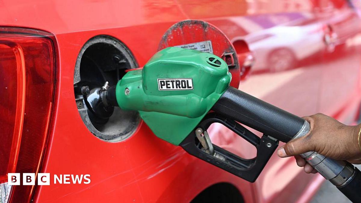 A worker fills a red car with fuel with a green pump labelled petrol on 23 May, 2026 in New Delhi, India.