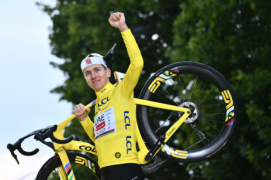 UAE Team Emirates - XRG team's Slovenian rider Tadej Pogacar celebrates on the podium with the overall leader's yellow jersey after the 21st and final stage of the 112th edition of the Tour de France cycling race, 132.3 km between Mantes-la-Ville and Paris Champs-&Eacute;lysees, on July 27, 2025. (Photo by Marco BERTORELLO / AFP)