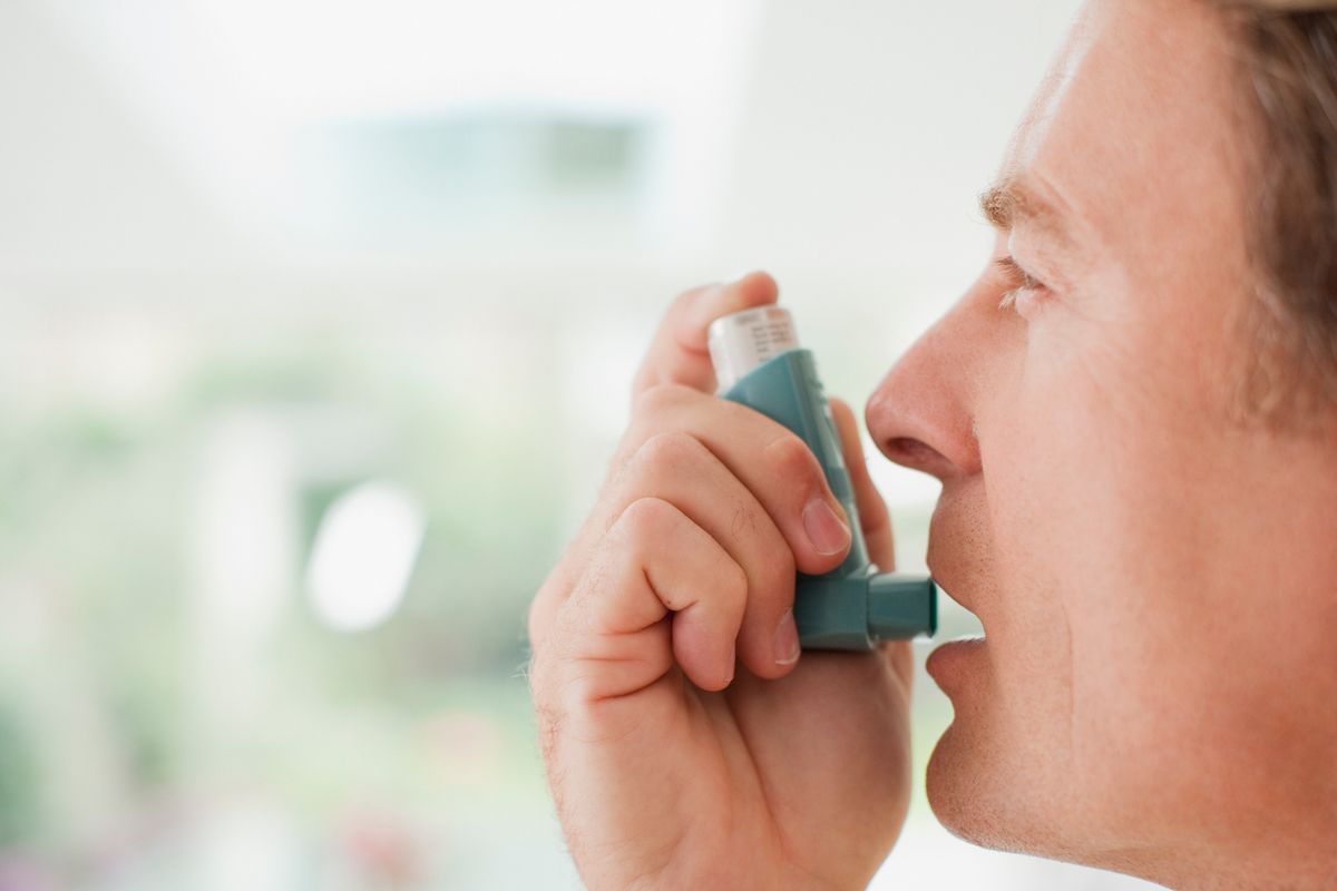 Person taking inhaler