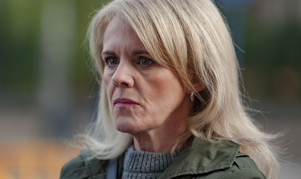 A woman looks concerned as she stands outside