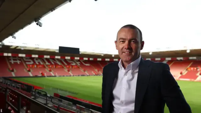 Phil Parsons, Chief Executive, Southampton Football Club,a short haired man stood in the St Mary's football ground.