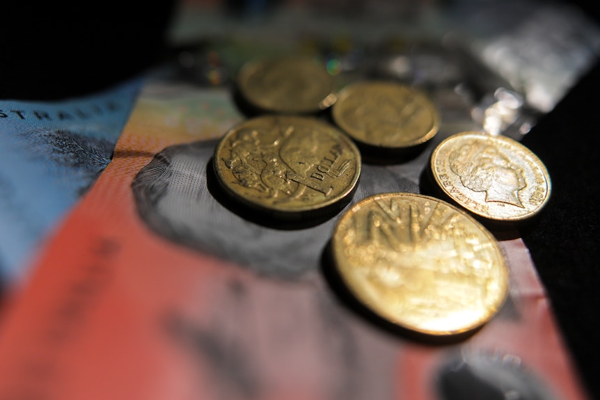 A pile of Australian money, in both coins and notes.