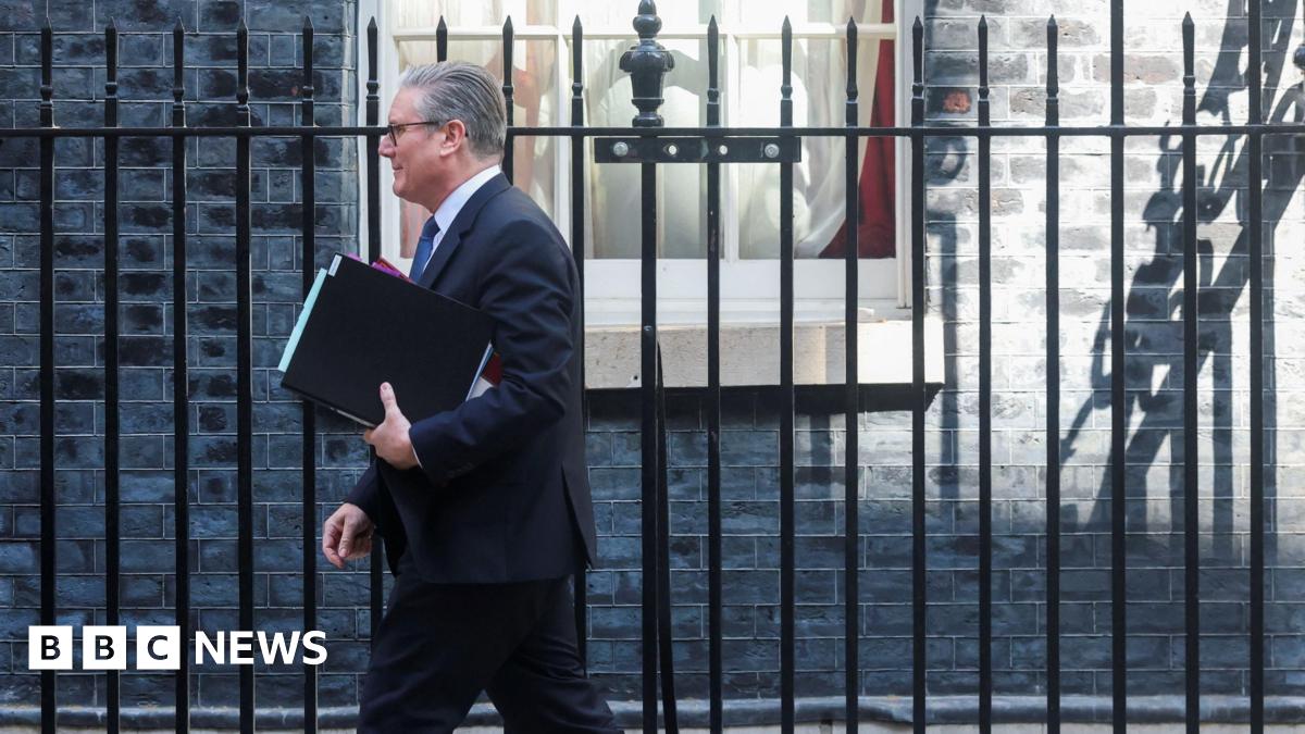 Prime Minister Keir Starmer walks outside 10 Downing Street on 22 April, 2026.
