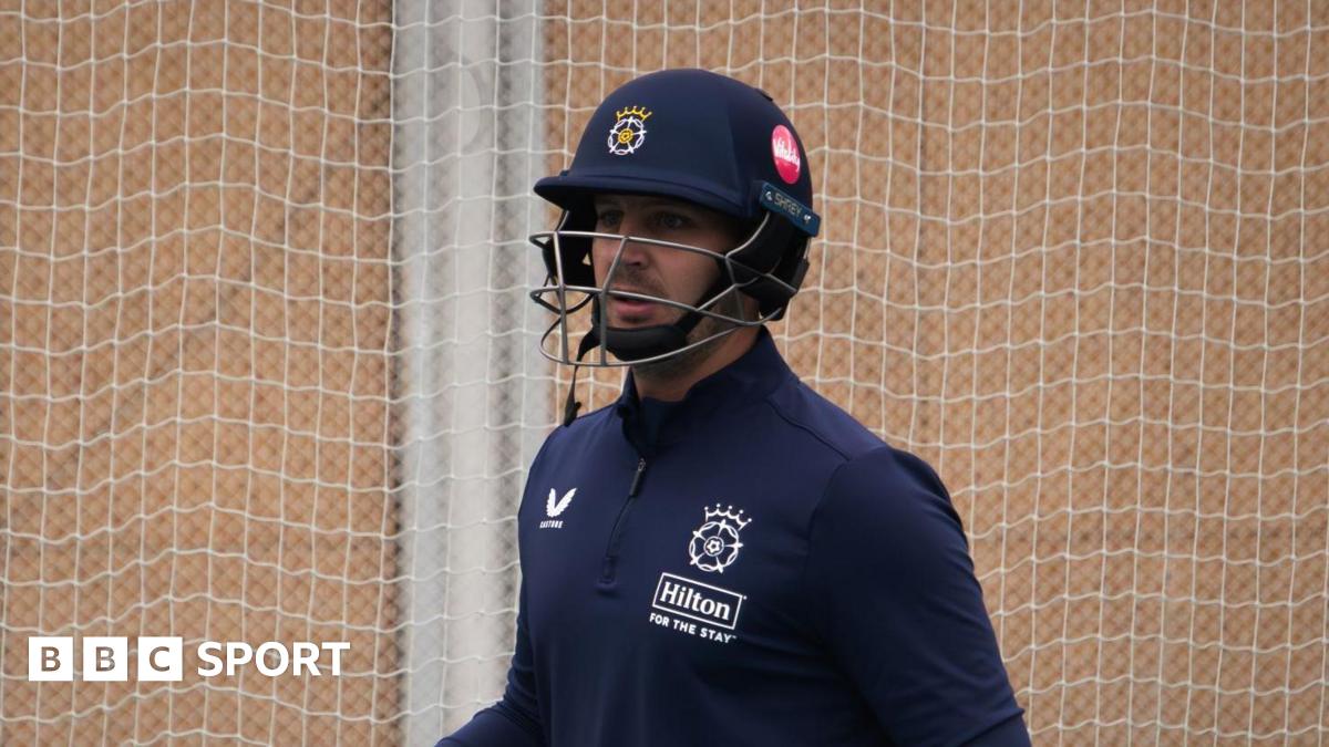 Delano Potgieter stands in the nets during a training session with Hampshire, wearing a helmet