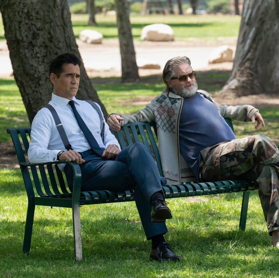 Two individuals seated on a park bench Two individuals seated on a park bench