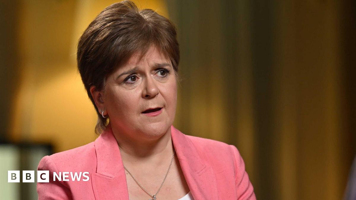 Sturgeon holds her finger up to the corner of her eye, appearing to wipe away a tear as she speaks to Laura Kuenssberg