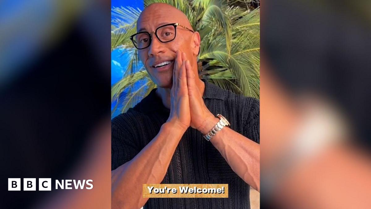 A screenshot of Dwayne Johnson's video to the students. The background is a tropical beach and the caption reads "You're welcome!"