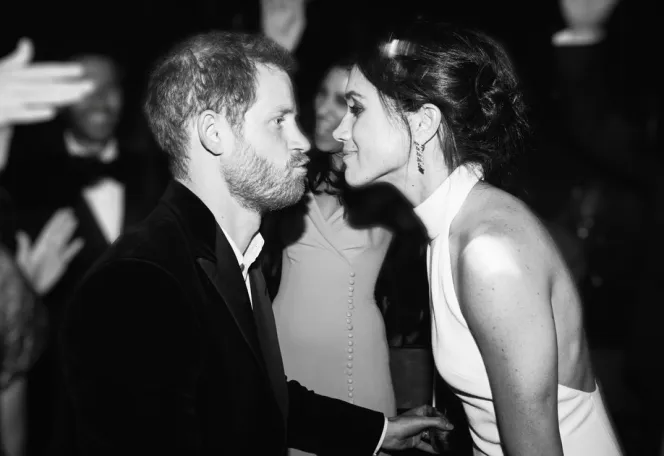 Prince Harry and Meghan Markle looking at each other at their wedding reception.