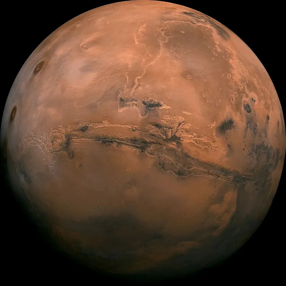 Mosaic of the Valles Marineris hemisphere of Mars projected into point perspective, a view similar to that which one would see from a spacecraft.