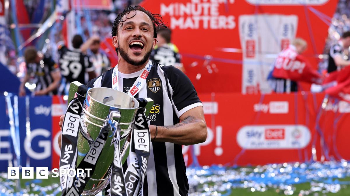 Jodi Jones holds the League Two play-off final trophy at Wembley
