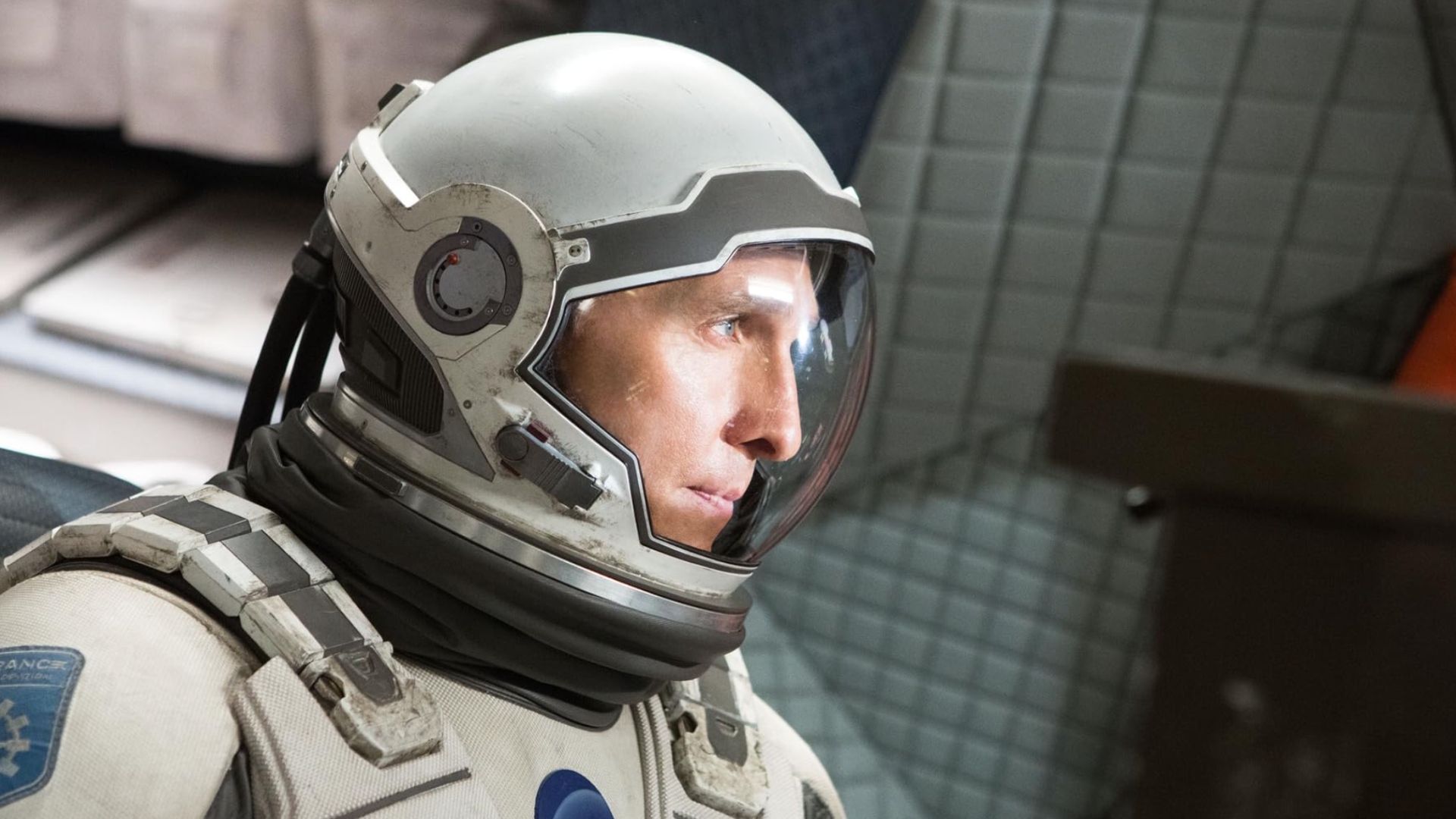 A still from the science fiction movie Interstellar, showing an astronaut inside a spaceship.