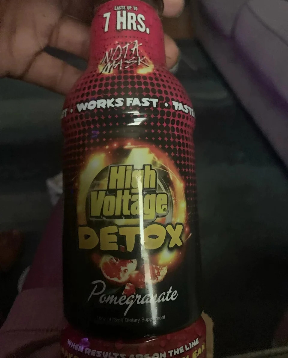 High Voltage Detox pomegranate flavor bottle held in hand, claims to work fast and last 7 hours