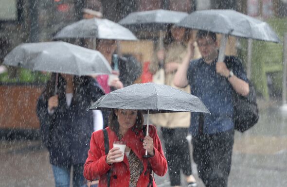 5 people with umbrellas