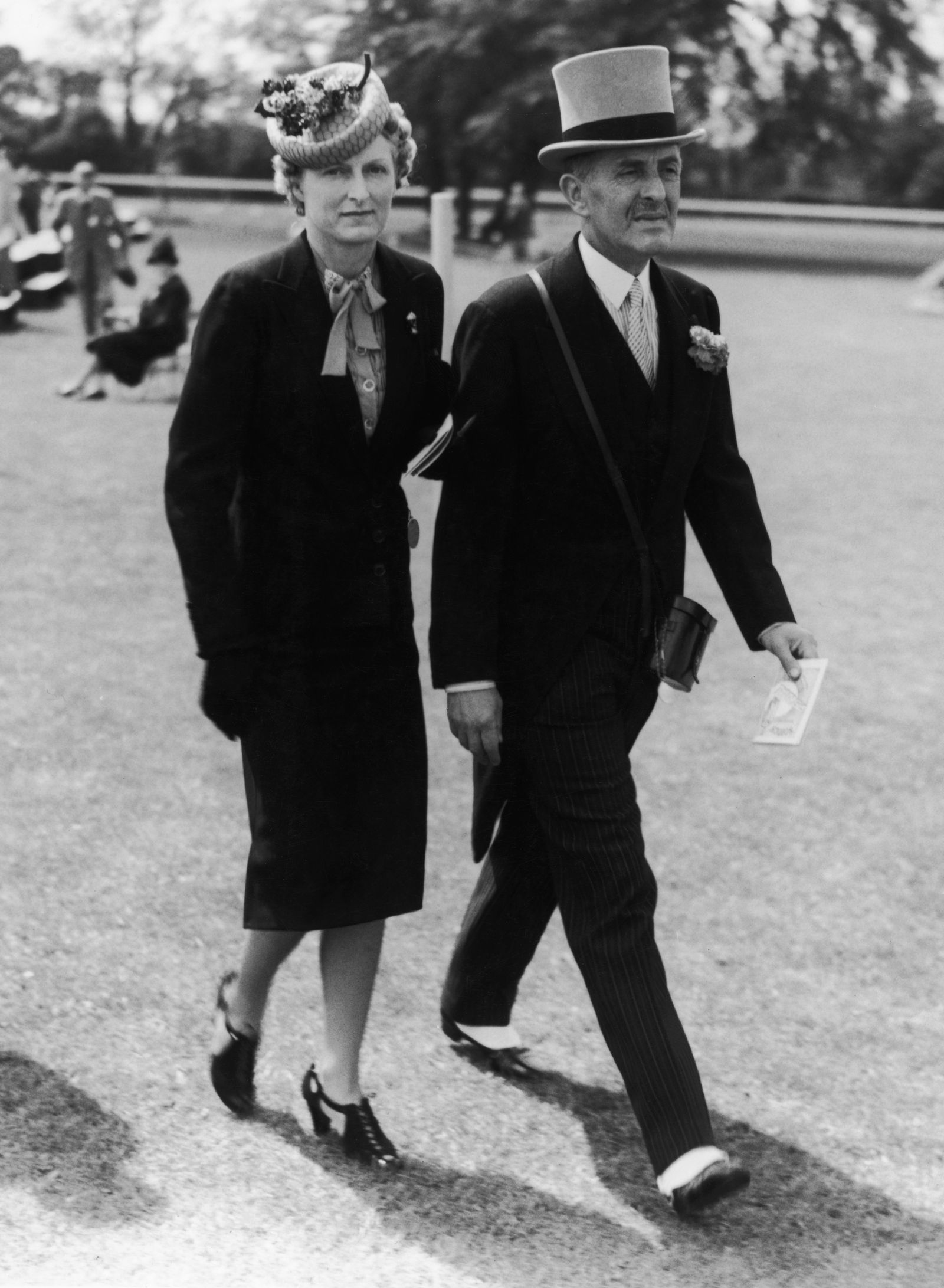 Image may contain Person Adult Clothing Coat Glove Footwear High Heel Shoe Hat Formal Wear Suit Face and Head