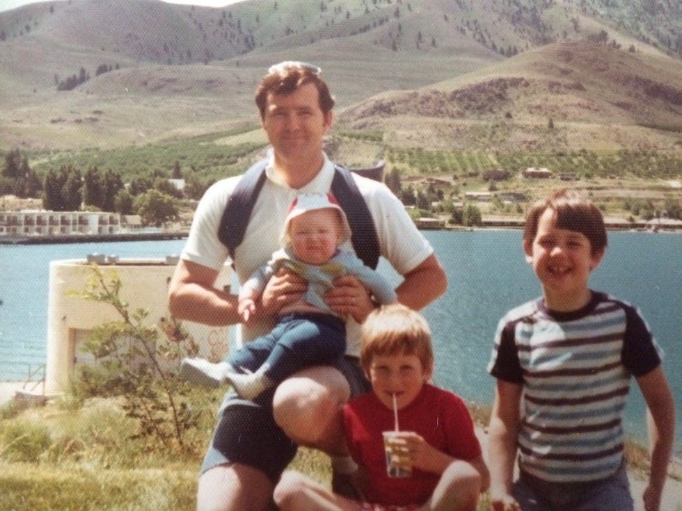 James Reynolds holding baby Ryan, with two of his other three sons in 1977