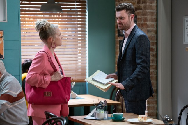 Linda and Johnny Carter having a tense talk in the cafe in EastEnders