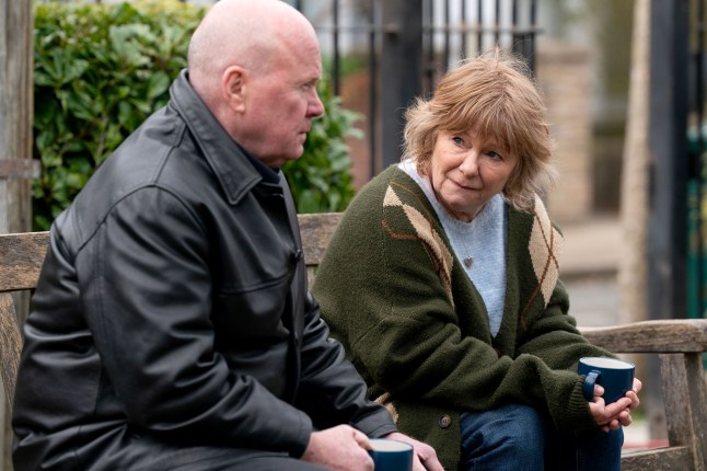 Phil speaks to Julie in Walford in EastEnders