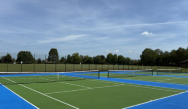 Three tennis courts coloured green and blue