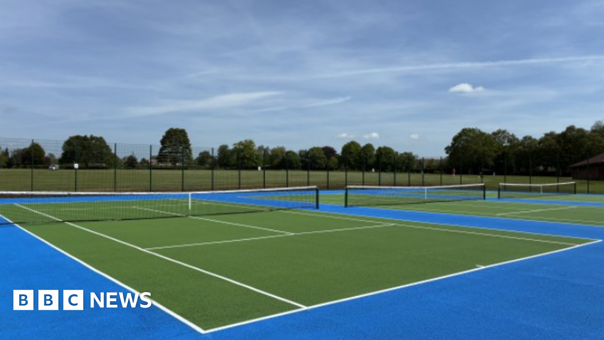 Three tennis courts coloured green and blue