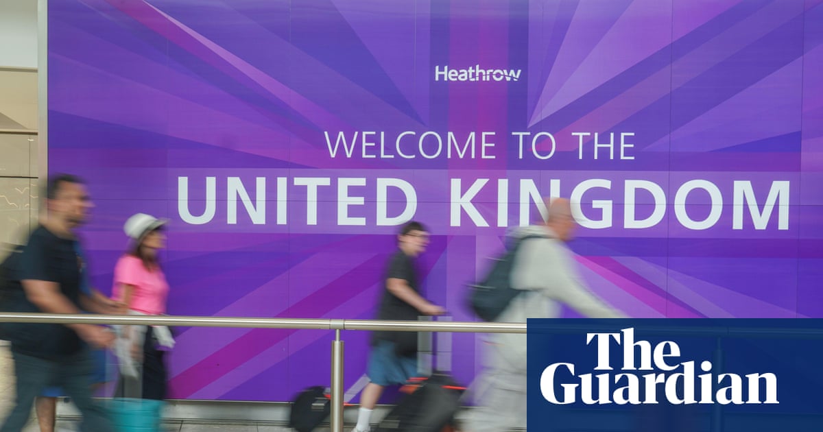 Net migration to UK falls by nearly 50% after Labour’s vow to cut numbers | Immigration and asylum