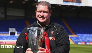 Liverpool Women manager Matt Beard holds the Women's Championship trophy ahead of kick-off between Liverpool and Sheffield United in 2022