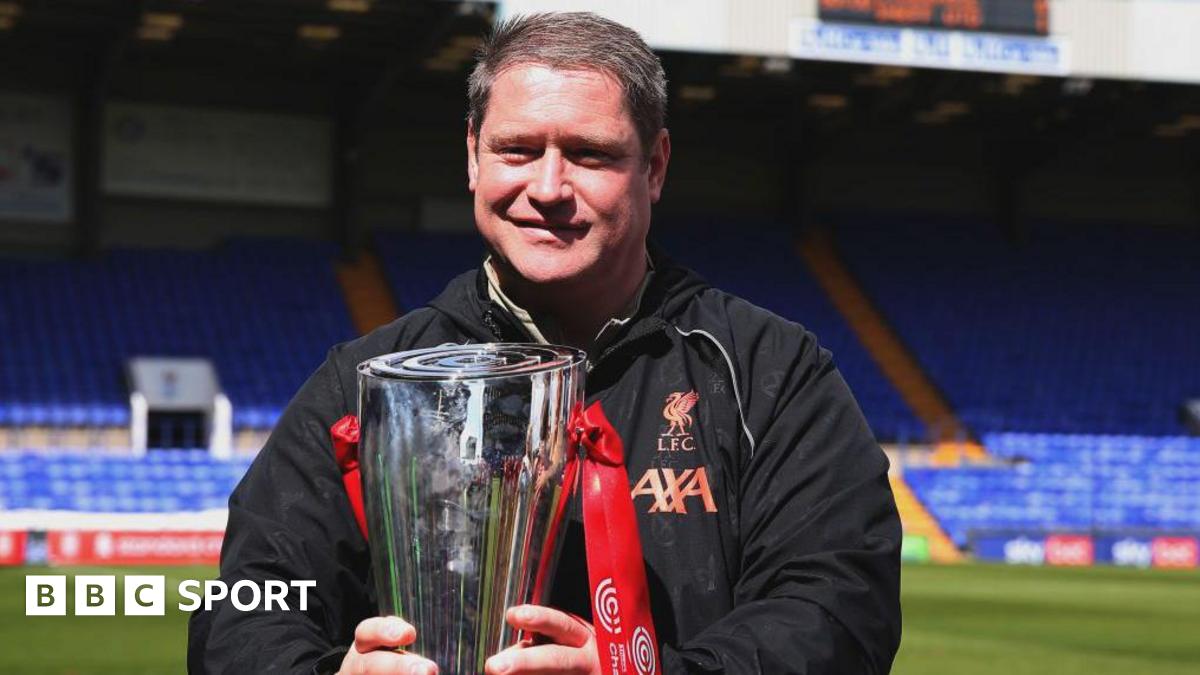 Liverpool Women manager Matt Beard holds the Women's Championship trophy ahead of kick-off between Liverpool and Sheffield United in 2022