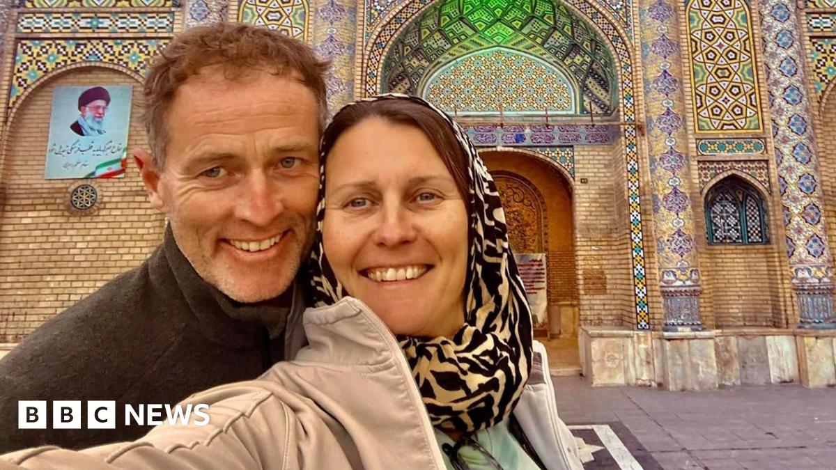 Selfie showing Lindsay and Craig Foreman outside a mosaic building.