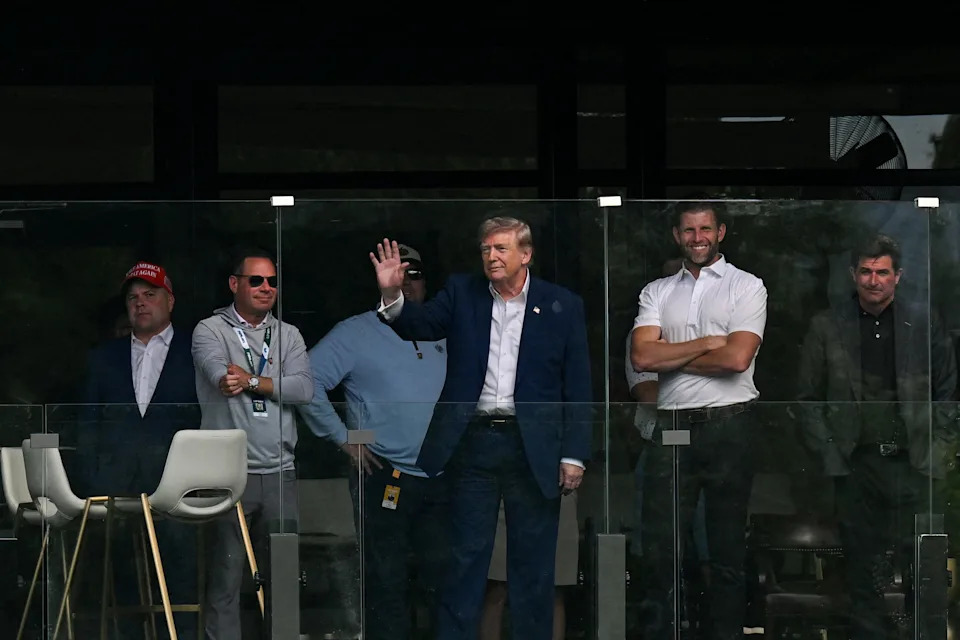 Donald Trump attended the LIV Golf Tournament at Trump National Golf Club in Sterling, Virginia, with his son Eric Trump. Eric and his older brother Don Jr. have been managing the Trump business empire while their father serves as president. / Annabelle Gordon/REUTERS