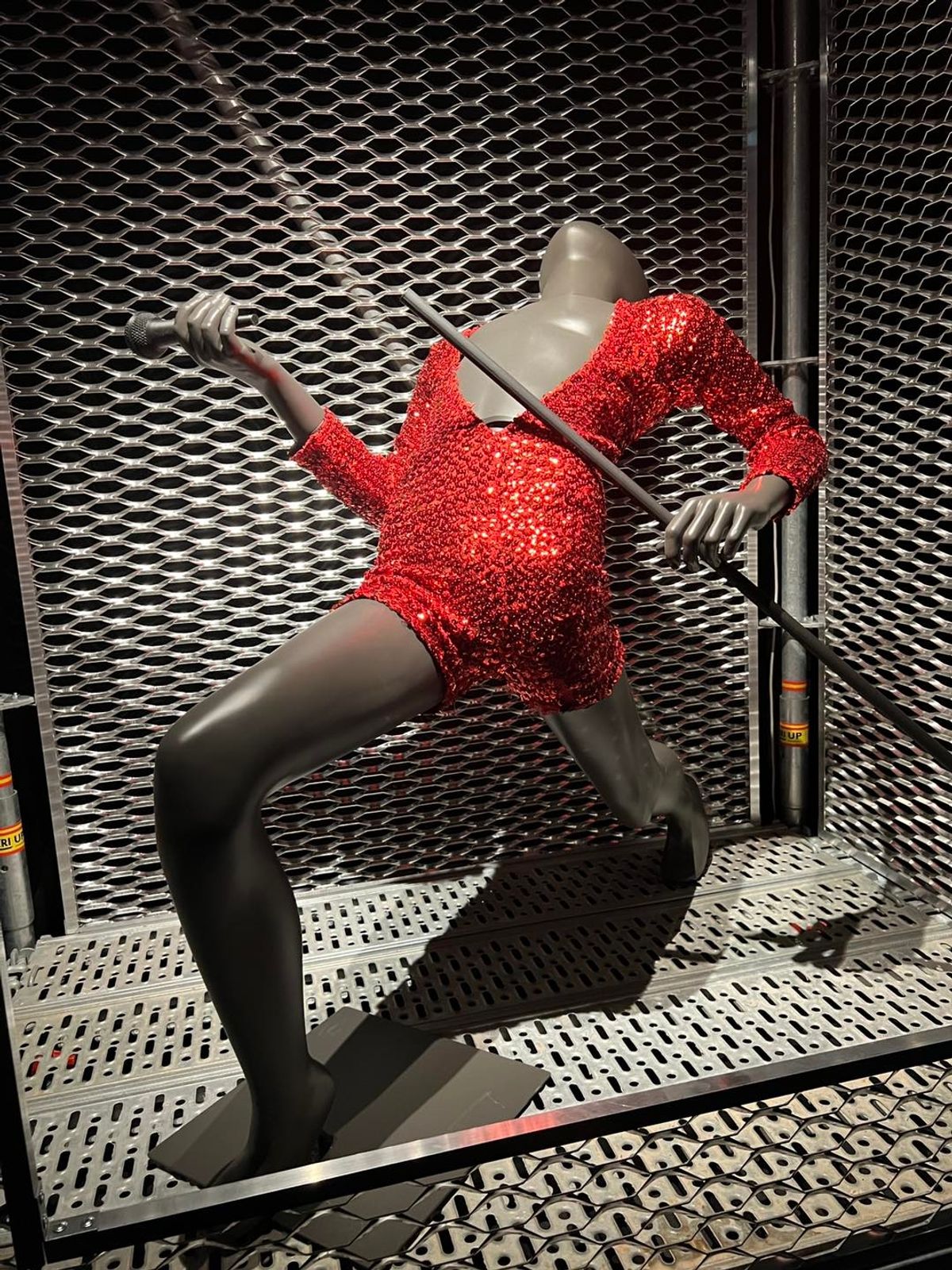 Freddie's glittering stage worn scarlett sequinned short legged one-piece stage suit worn on the News of the World tour 1978.