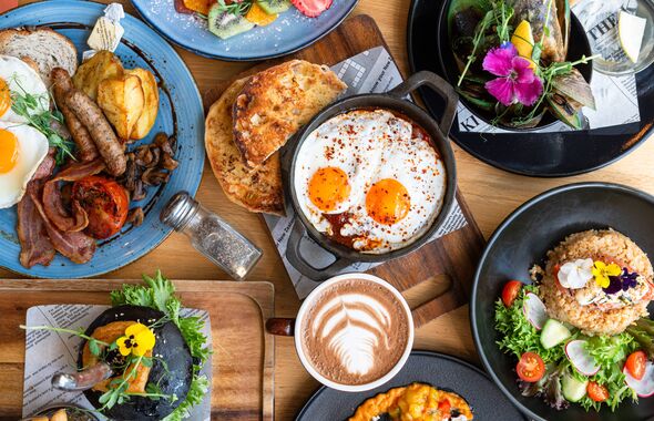 Table top view of breakfast food displayed on table. Table top view of breakfast food displayed on table.