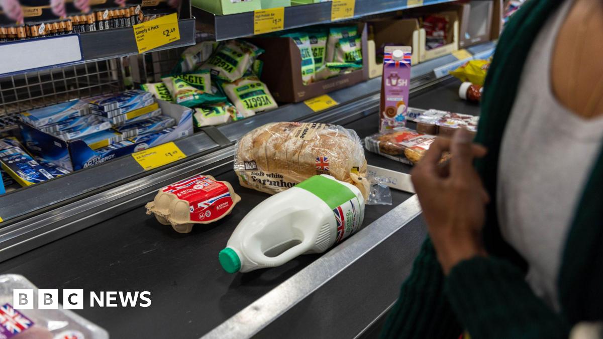 Eggs, bread, milk, and other food on a conveyor belt