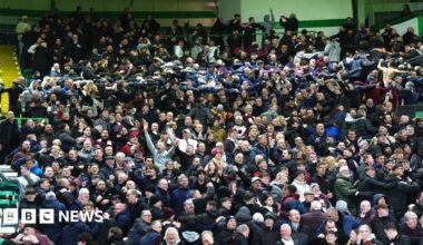 Heart of Midlothian fans celebrate their side's second goal of the game, scored by player Oisin McEntee (not pictured) during the William Hill Premiership match at Celtic Park, Glasgow.