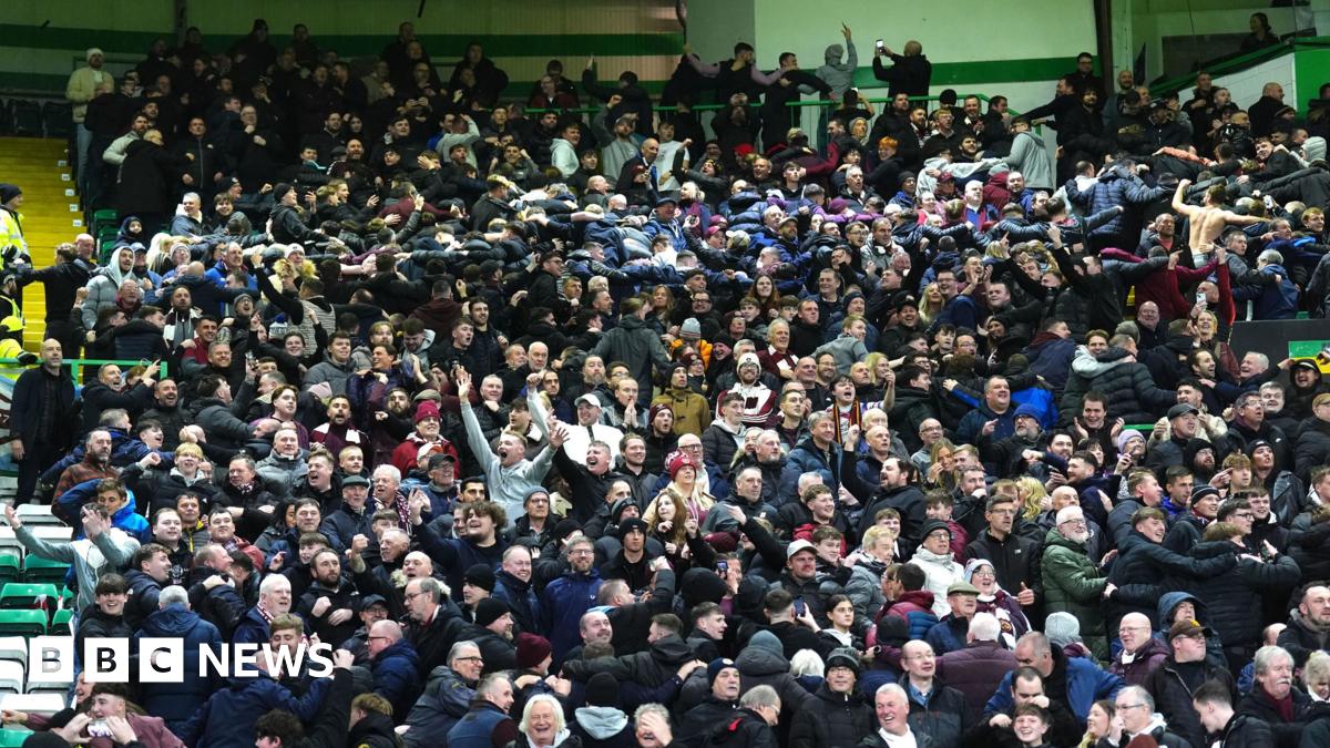 Heart of Midlothian fans celebrate their side's second goal of the game, scored by player Oisin McEntee (not pictured) during the William Hill Premiership match at Celtic Park, Glasgow.