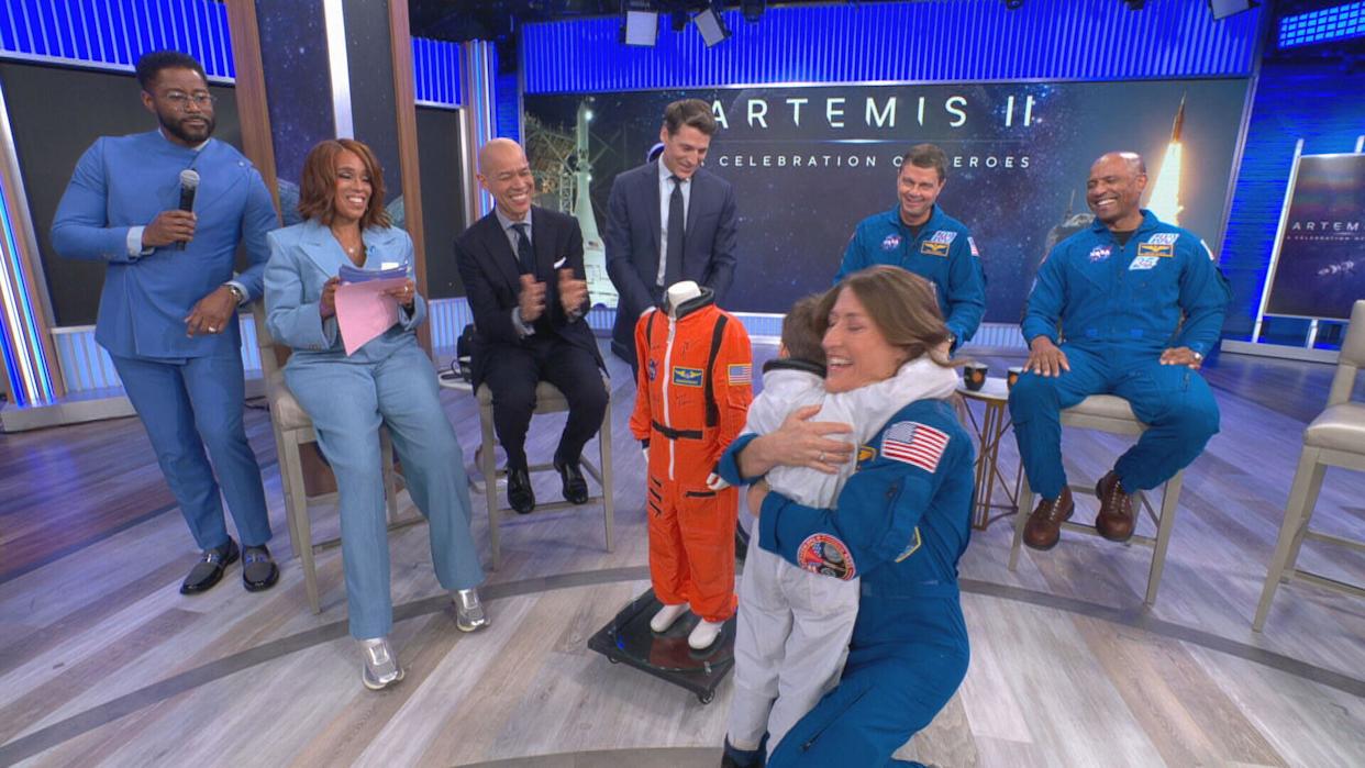 Jack hugs Artemis II mission specialist Christina Koch after he was given a spacesuit. / Credit: CBS News