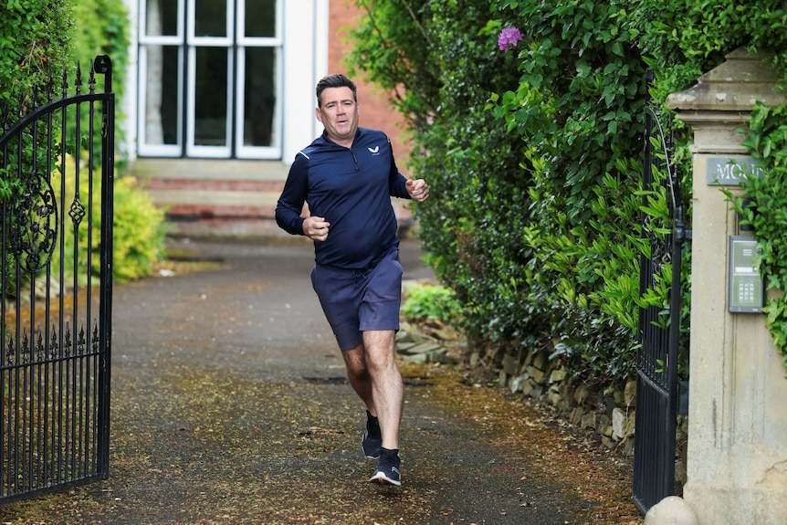 A man running down a driveway