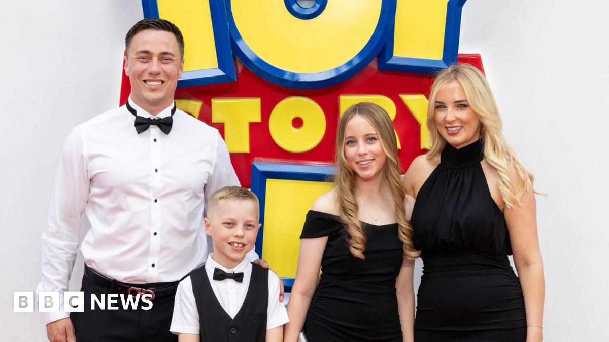 The family lined up for a photo in their formal clothes