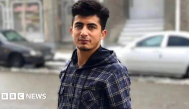 Mehrab Abdollahzadeh looks at the camera. He is wearing a blue chequered shirt.