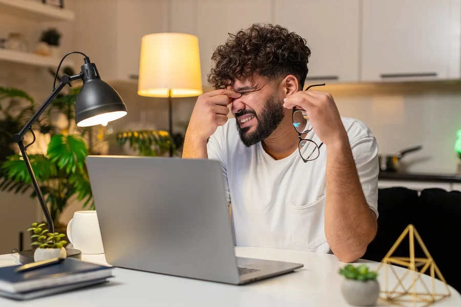 Man with eye strain