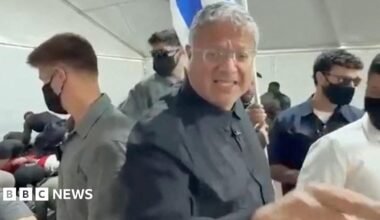 Israeli National Security Minister gestures in front of an Israeli flag while touring  a facility in the Israeli port of Ashdod where pro-Palestinian activists from a Gaza-bound flotilla are being detained (20 May 2026)
