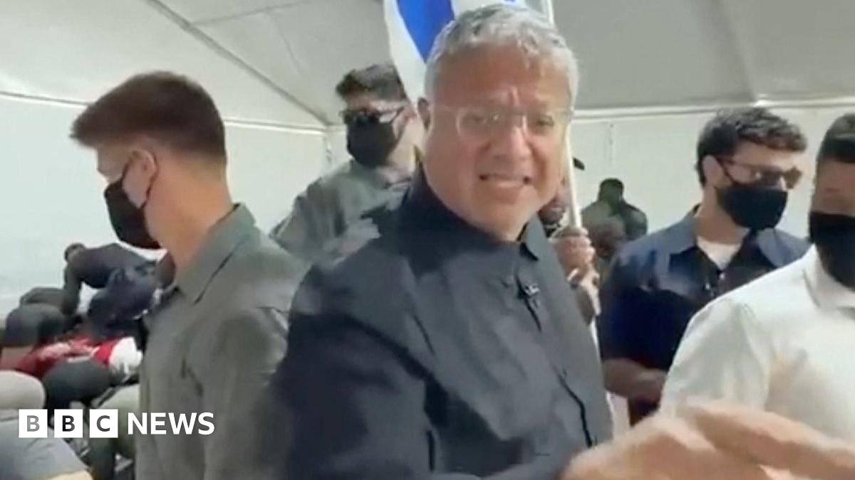 Israeli National Security Minister gestures in front of an Israeli flag while touring  a facility in the Israeli port of Ashdod where pro-Palestinian activists from a Gaza-bound flotilla are being detained (20 May 2026)