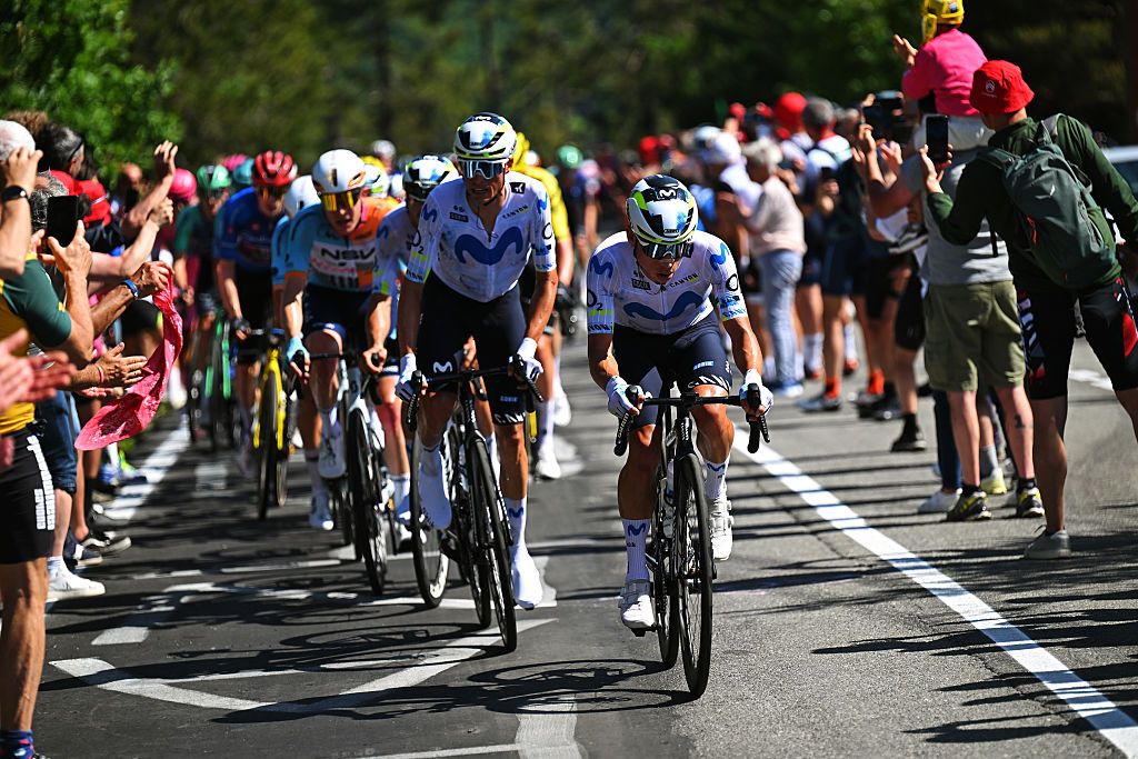 Movistar leads the peloton through fans on stage 12 of the GIro d'Italia
