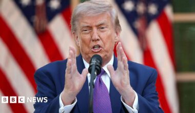US President Donald Trump wearing a purple tie.