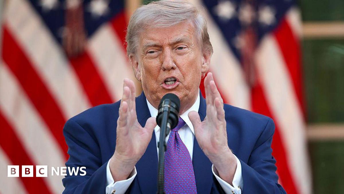 US President Donald Trump wearing a purple tie.
