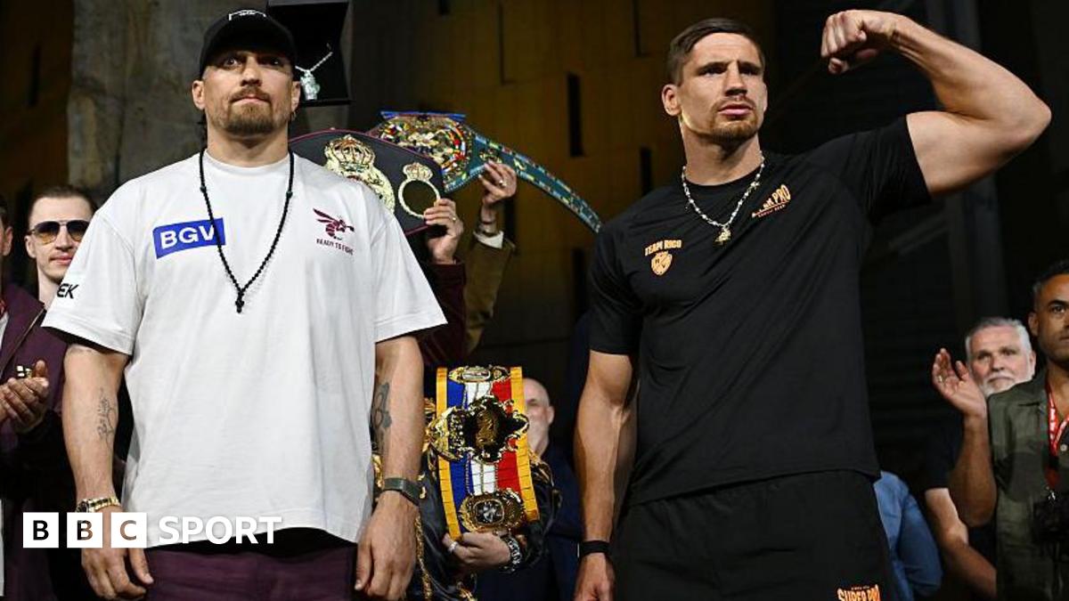Oleksandr Usyk and Rico Verhoeven pose at the weigh-in
