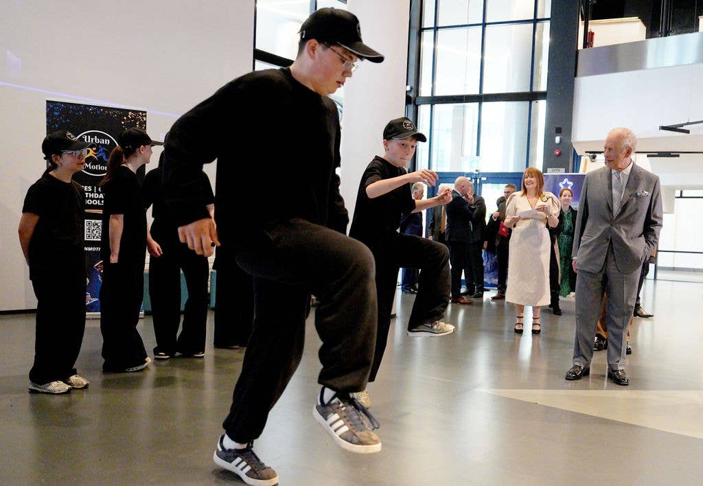 King Charles III watches a dance performance during his visit to the W5 Life
