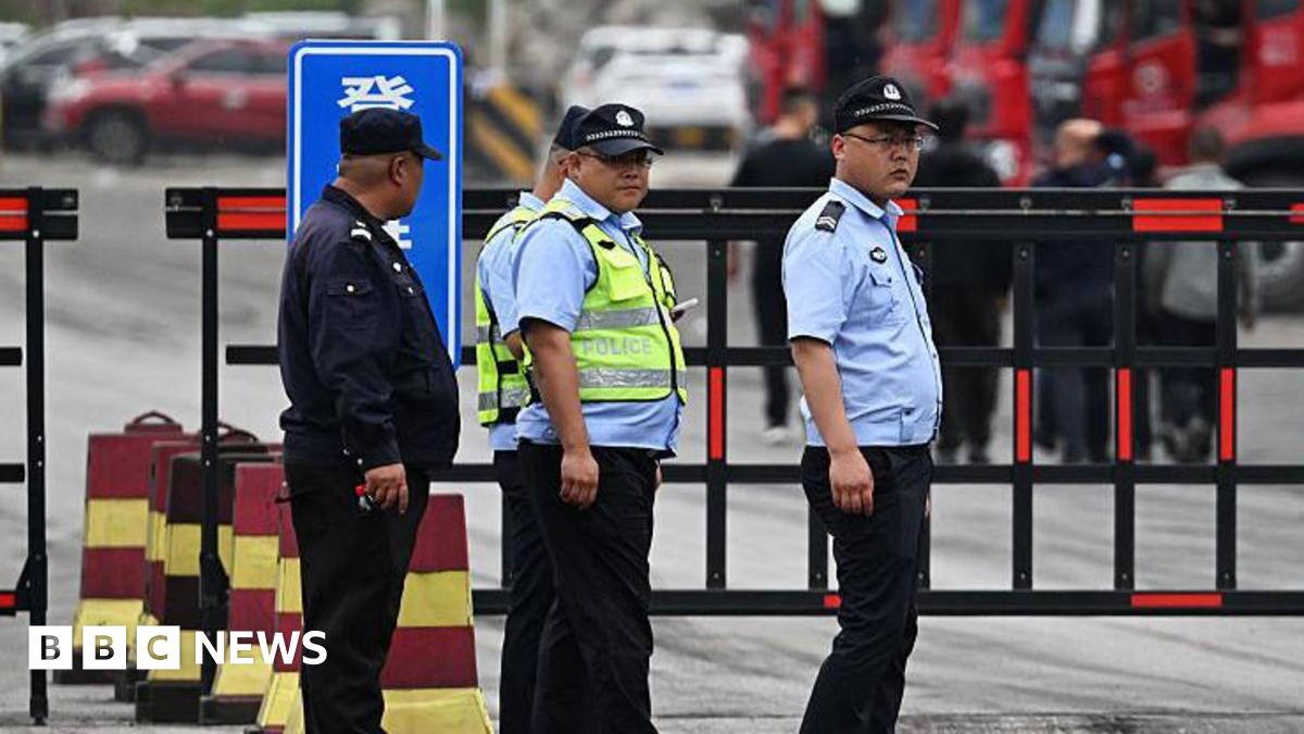 Police guard the road outside the Liushenyu coal mine, where an explosion killed dozens in Qinyuan county, in China's northern Shanxi province on May 24, 2026.