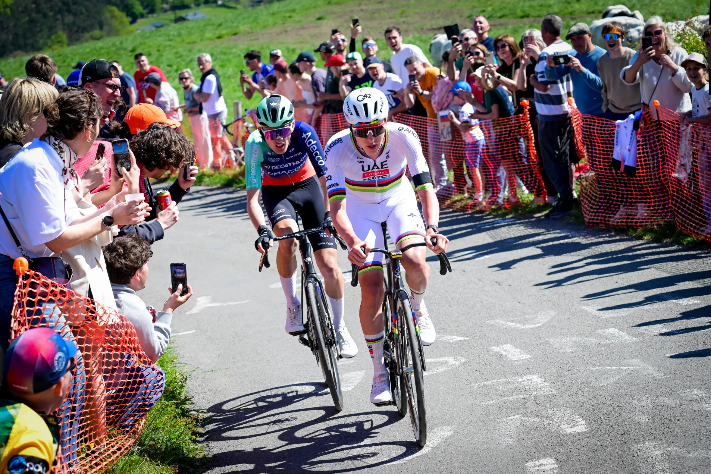Cyclists Paul Seixas and Tadej Pogacar in action during the Liege-Bastogne-Liege UCI World Tour one-day cycling race.